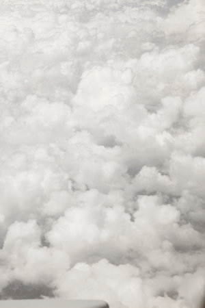 A earth and clouds with an airplane on nature in the sky backgroundの写真素材