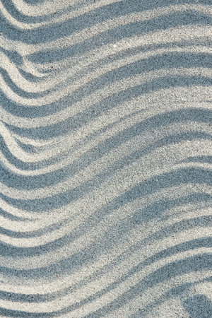 beautiful drawings on the sand of the sea shoreの写真素材