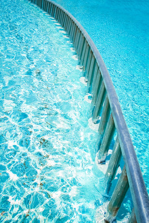 Beautiful swimming pool at the seaside hotel in park backgroundの写真素材