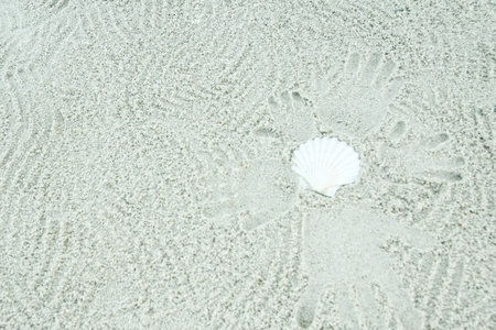 beautiful pattern on the sea sand on nature backgroundの写真素材