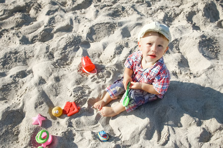happy child playing by the sea outdoorsの写真素材