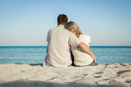 happy loving couple by the sea in the natureの写真素材