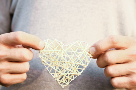 Female hands giving heart love friendshipの写真素材