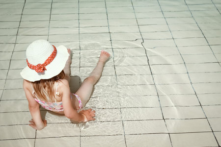 a happy child by the pool at seaの写真素材