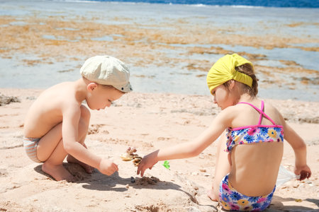 Happy child playing on the sea backgroundの写真素材