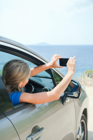 happy girl from car at sea greece backgroundの写真素材