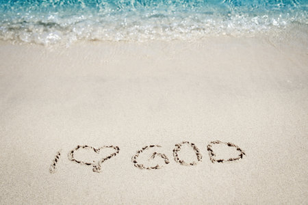 Beautiful drawing on the sand of the sea backgroundの写真素材