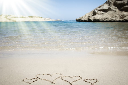 Beautiful drawing on the sand of the sea backgroundの写真素材
