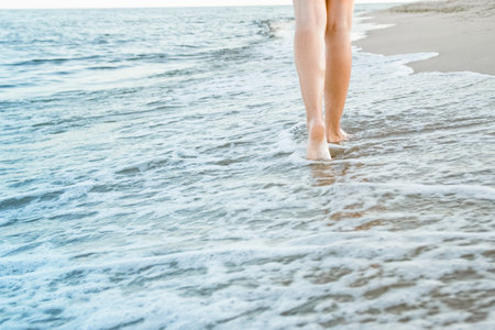 stylish beautiful legs with traces of the sea in the summer on the natureの写真素材