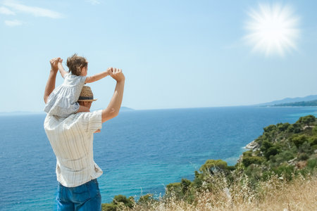 hands of happy parents and children at sea in travel background in greeceの写真素材