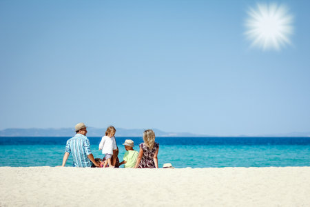 happy family at sea in greece on nature backgroundの写真素材
