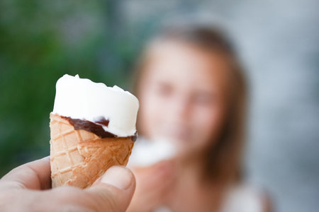 happy child with ice cream in hands in nature travelの写真素材