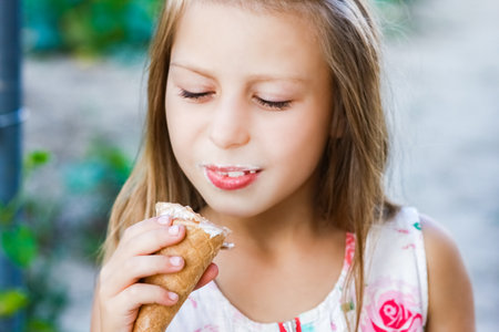 happy child with ice cream in hands in nature travelの写真素材