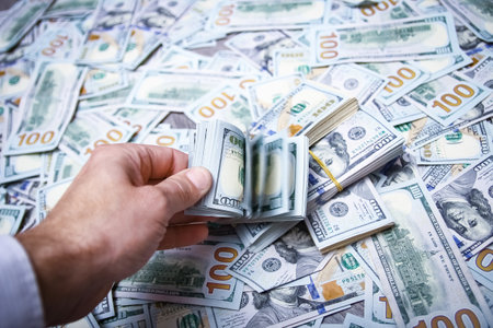 Dollars in the hands of a businessman man guy for a trip to the rest of the shopsの写真素材