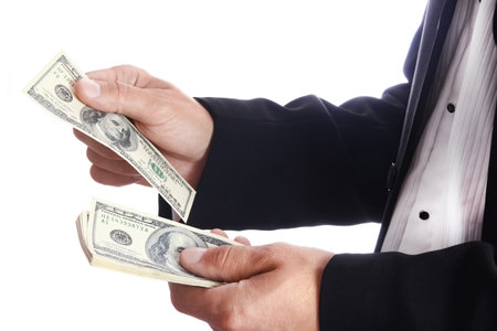 Business man holding money on white backgroundの写真素材