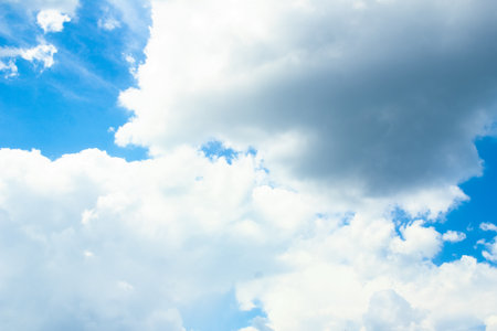 Fantastic soft white clouds against blue skyの写真素材