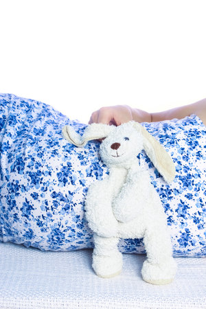 Happy pregnant girl lies on white backgroundの写真素材