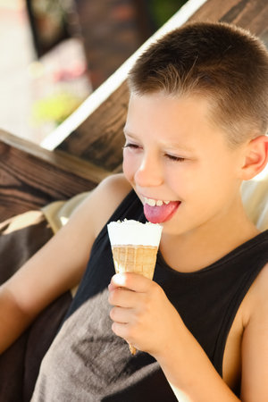 happy child with ice cream in hands in nature travelの写真素材