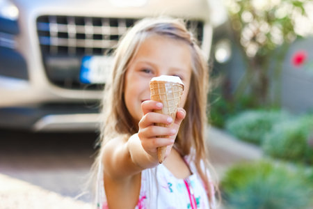 happy child with ice cream in hands in nature travelの写真素材