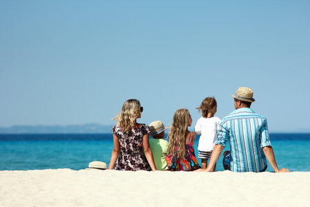happy family at sea in greece on nature backgroundの写真素材