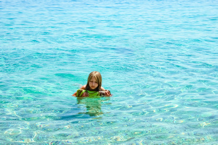happy child playing at sea in greeceの写真素材