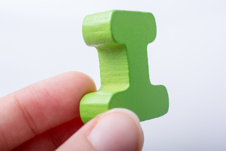 Hand holding Letter cube of I of  Alphabetの写真素材