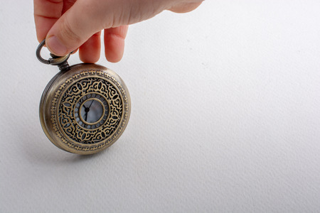 Retro style pocket watch in the handの写真素材