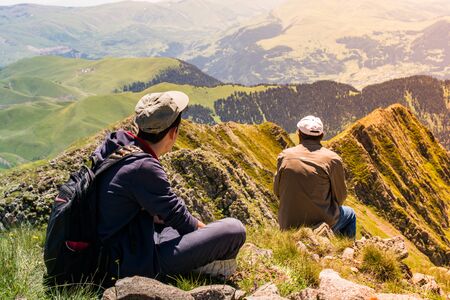 hikers with backpacks and trekking poles walking in Turkish highland