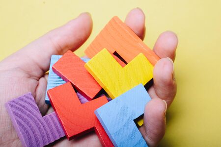Piece of wooden colorful  puzzle as problem solving conceptの写真素材