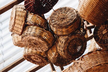 Empty wicker baskets are for sale in a market placeの写真素材