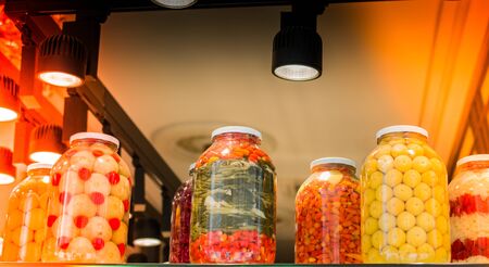 Pickled fermented vegetables in jars for long-term storageの写真素材