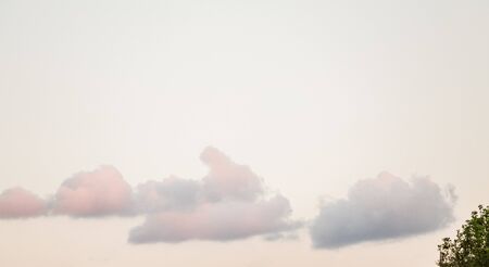 Grey color clouds partly cover the sky in the daytimeの写真素材