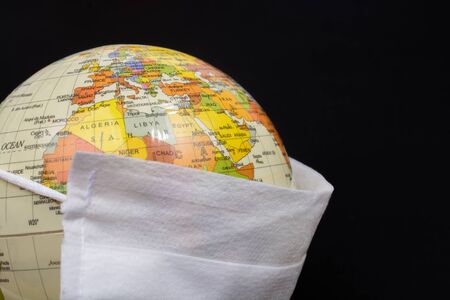 Mask with globe for safety  against Coronavirus Covid-19 virus.の写真素材