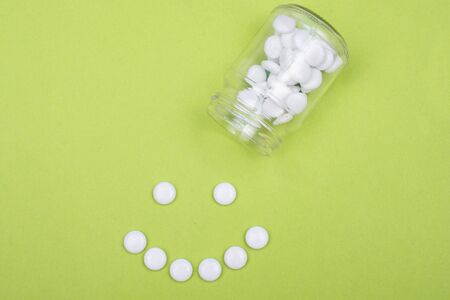 White pill and glass  bottle container. Pharmaceutical industry. Pharmacy.の写真素材