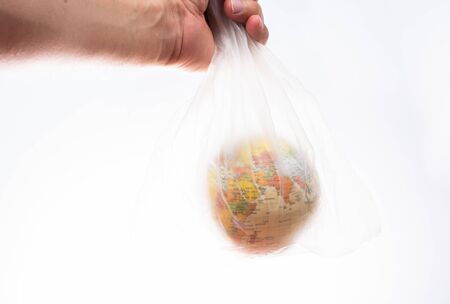 World globe in plastic bag isolated on white background