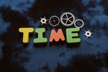 Colorful time wording with gears as time conceptの写真素材
