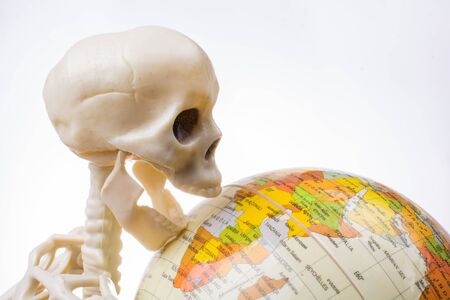 the earth in a skeleton hand