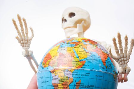 the earth in a skeleton handの写真素材