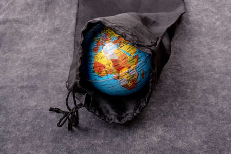 Close-up of a globe model on a white backgroundの写真素材