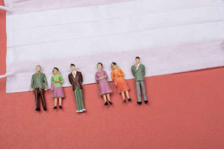 White color medical mask on red colorの写真素材