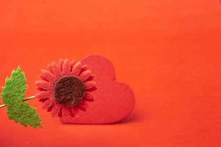 Red heart shaped on red color for love card and valentine day conceptの写真素材