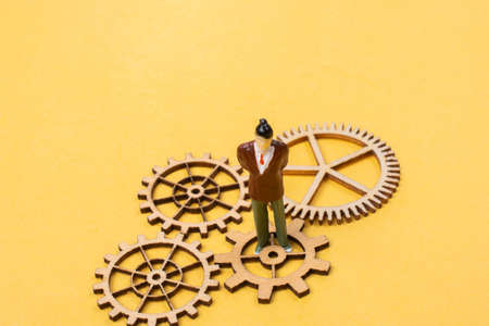 Industrial composition. Man with cogwheel gearsの写真素材