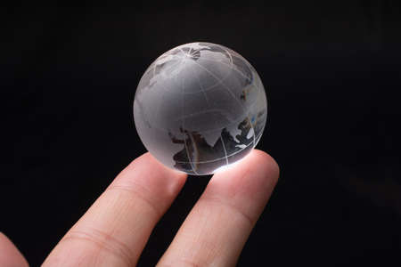 Glass globe for environment and conservation. Global business or education  concepts