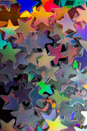 Colorful confetti  stars on a dark backgroundの写真素材