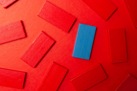 Colorful dominoes. Rainbow colored chain reaction.