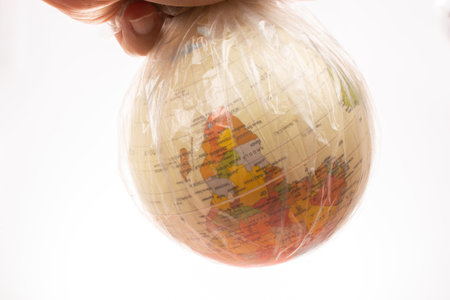 World globe in plastic bag isolated on white backgroundの写真素材