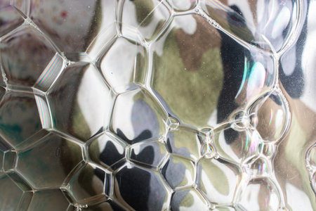 Oil bubbles inside water base form patternsの写真素材