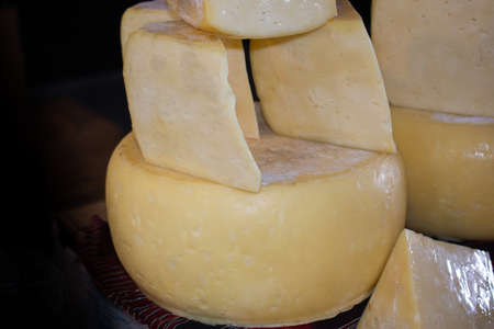 cuts of kashkaval or kasseri  cheese for sale on the shelfの写真素材