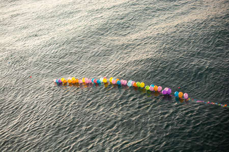 Balloon on a string  on water for shooting gameの写真素材