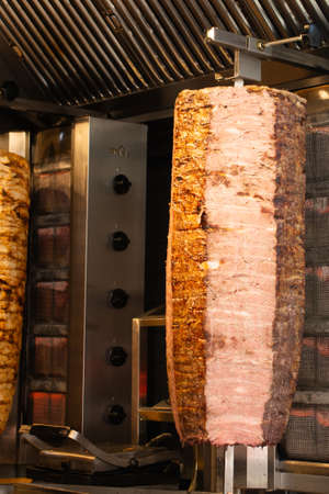 Traditional Turkish food Doner Kebab. Turnspit skewing kebap  kebab shawarmaの写真素材